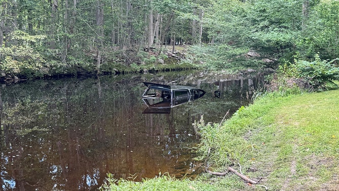 Fairfield officers were notified Thursday afternoon by a neighboring police department of a vehicle submerged in the Aspetuck River, directly behind Aspetuck Falls in Fairfield.