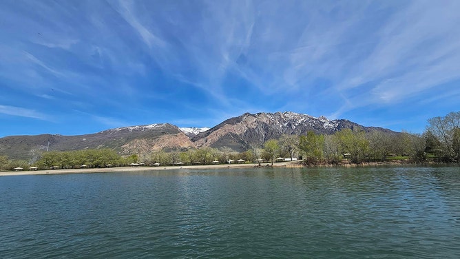 A Utah father drowned over the weekend while trying to rescue his son, who had jumped into an area lake to save a young woman as the weather turned stormy, authorities said.