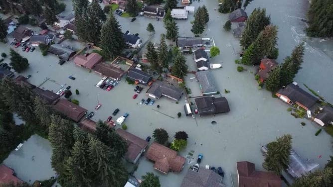 This photo shows a flooded neighborhood in Alaska due to glacial lake outburst flooding.
