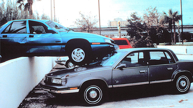 Cars in a parking lot.