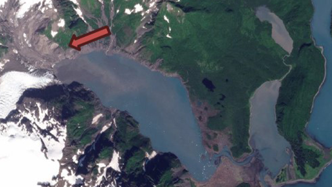 This satellite image shows the Pendersen Lagoon in Alaska where a landslide triggered tsunami was reported in August. The red arrow shows the approximate location of the landslide.