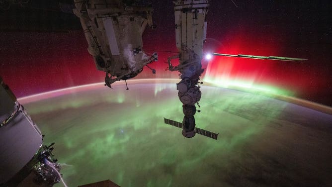 NASA astronaut Matthew Dominick rotated this image 180 degrees to show the Aurora lights as though you are looking down at Earth.