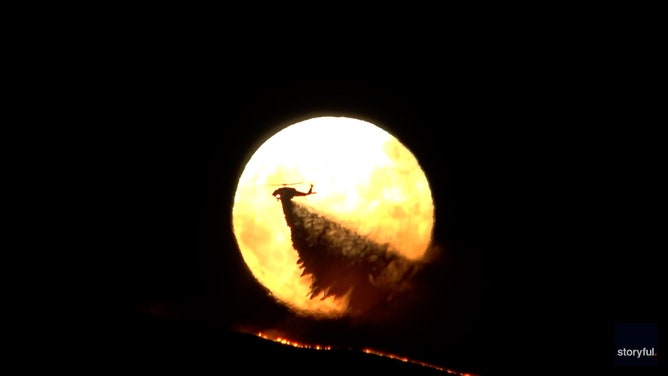 A shot of the first supermoon of 2024, rising over San Jose on August 19, took on epic proportions as it framed a helicopter dropping flame retardant on a raging wildfire.