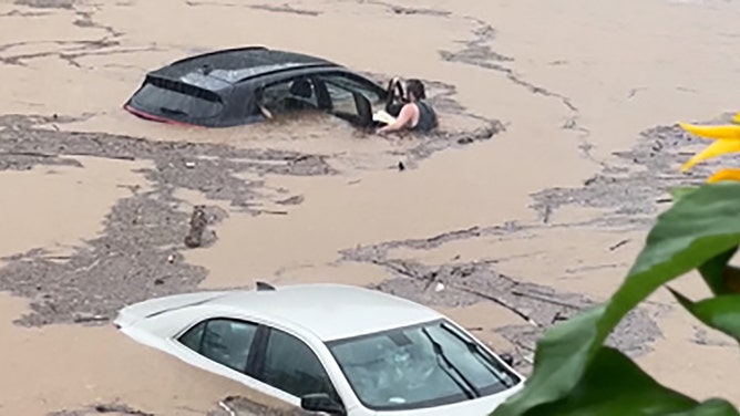 A stranded motorist and his dog were rescued in the town of Southbury, Connecticut, on Sunday, August 18, as severe flash flooding hit parts of the region.