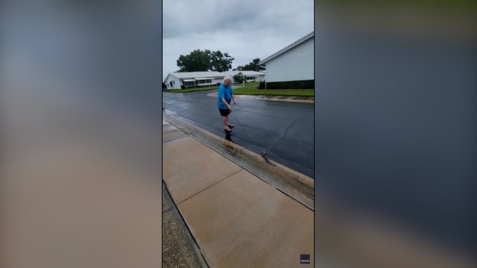 In Pinellas Park, Joanna Mack and her husband, Stan, used shovels and fishing rods to help push a catfish toward storm drains and into deeper water.