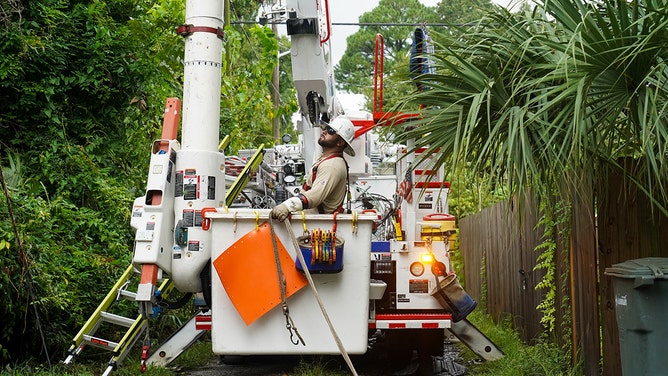 Power line crews come out to help people who are experiencing difficulty with their power August 6, 2024 in Savannah, Georgia.