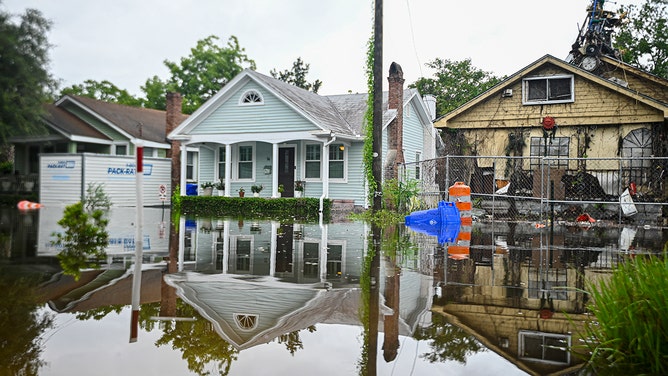 Houses are seen in a flooded street due to Tropical Storm Debby on August 6, 2024 in Charleston, South Carolina.