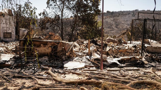 The remains of a burned out home following a wildfire in Varnavas, east of Athens, Greece, on Tuesday, Aug. 13, 2024. Climate change is turbo-charging the threat posed by wildfires, with Greece suffering its worst season in two decades. Photographer: Nick Paleologos/Bloomberg via Getty Images