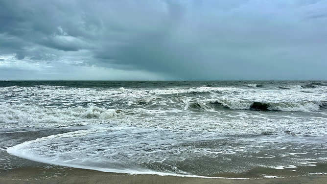 Waves crash ashore on Carolina Beach in Pleasure Island, North Carolina, on Wednesday.