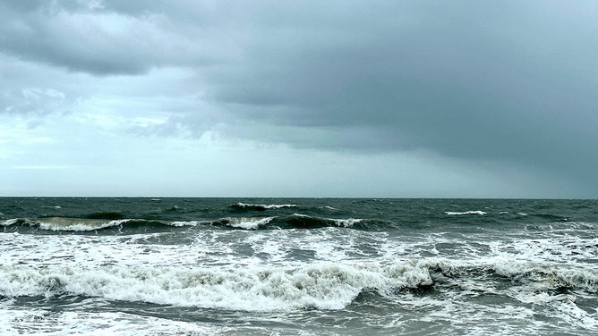 Waves crash ashore on Carolina Beach in Pleasure Island, North Carolina, on Wednesday.