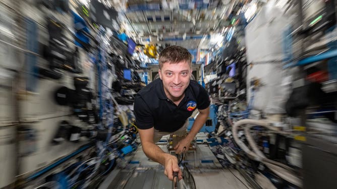 NASA Astronauts Matthew Dominick takes a selfie while floating through the International Space Station.