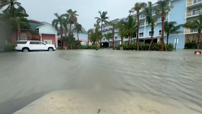 Floodwater in front of a building.