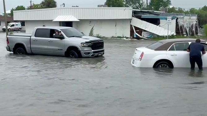 Drivers stranded in floodwater.