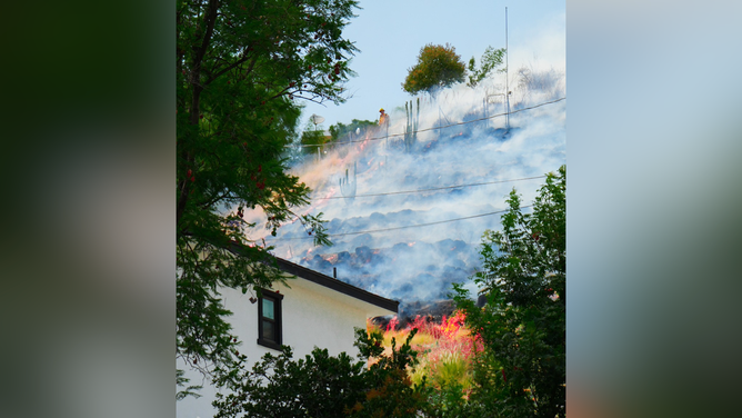 The Edgehill Fire burns near a residential area in San Bernardino.