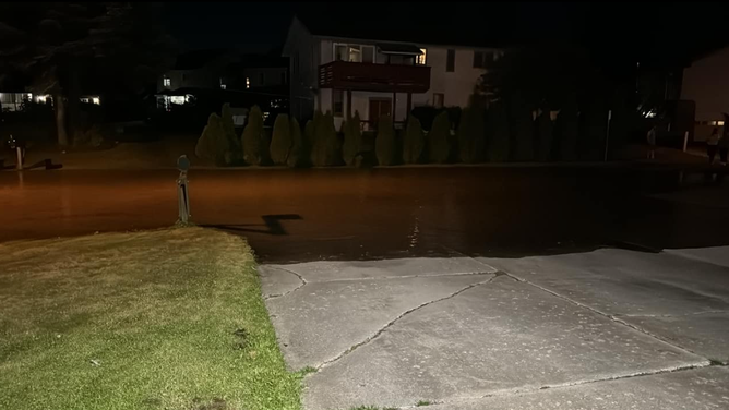 The street in front of the Lindoff home, as it begins to flood.