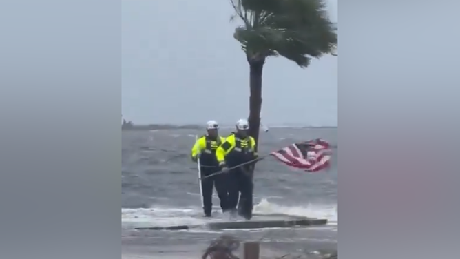 Florida Task Force 2 members saving an American flag as Debby hit Florida.