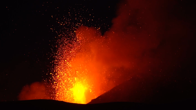 Mt. Etna shoots lava into the air.