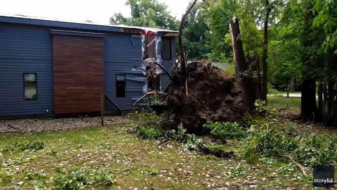 A Michigan home was torn to shreds by falling trees when a line of severe storms hit the region on Wednesday.
