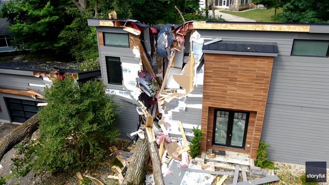A Michigan home was torn to shreds by falling trees when a line of severe storms hit the region on Wednesday.