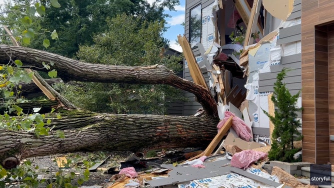 A Michigan home was torn to shreds by falling trees when a line of severe storms hit the region on Wednesday.