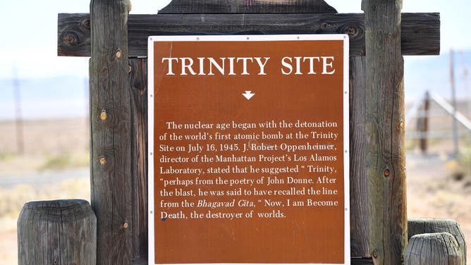 A sign for the Trinity test site, near White Sands, New Mexico on February 21, 2024. The events of 5:30 am on July 16, 1945, when the world's first atomic bomob exploded, are now best known to millions from their dramatic re-enactment in the Oscar-tipped movie "Oppenheimer." The film presents the Trinity test site as a vast, empty desert, but thousands of people lived within a 50-mile radius of the site.