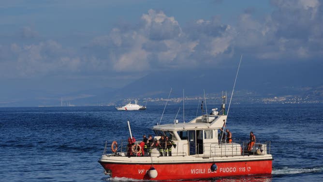 A dive team from the Italian Fire and Rescue Service leaving the site of the Bayesian on the fourth day of the search for the six tourists missing after the luxury yacht sank in a storm on Monday whilst moored around half a mile off Porticello on the Sicilian coast.