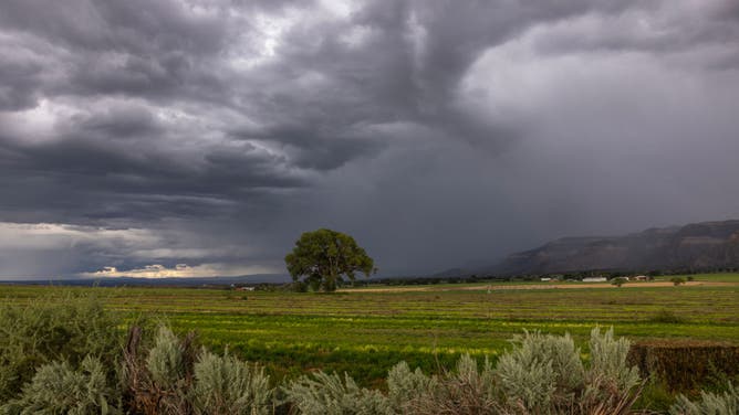 Storm clouds pass over farmland as monsoon season storms persist on August 24, 2024 near Cortez, Colorado.