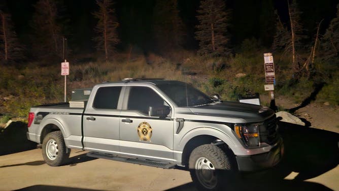 DWR vehicle near trail.