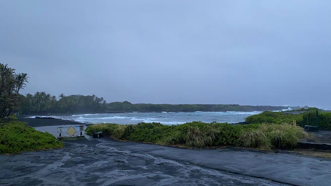 Rough surf created by Hurricane Hone passing south of the Big Island creates tide pools at Black Sand Beach in Punalu'u.