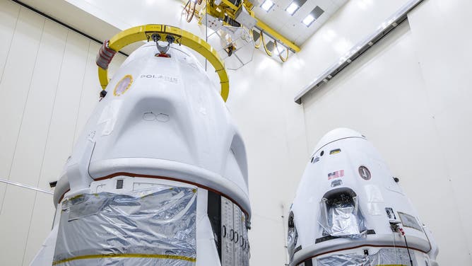 Two SpaceX Dragon spacecraft being prepared for launch. The Polaris Dawn mission is scheduled to launch on Aug. 27. SpaceX is targeting late September to launch NASA's Crew-9 mission.