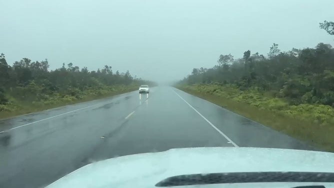 This image shows heavy rain falling as Hurricane Hone spins off to the south of Hawaii.