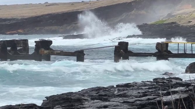 Rough surf and large waves are seen in Hawaii as Hurricane Hone spins to the south of the Big Island.