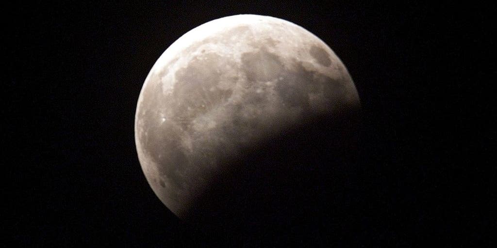 When will we see the partial lunar eclipse on Tuesday?