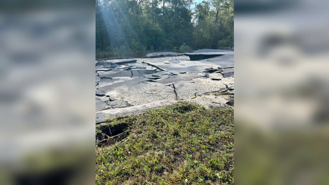 A flooded and broken up portion of road on U.S. 17 in Brunswick County, NC.