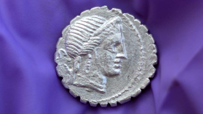 A handout image depicts one of the 27 silver Roman coins, dating from 94 to 74 BC, found in a treasure trove on the remote island of Pantelleria, Sicily, Italy.