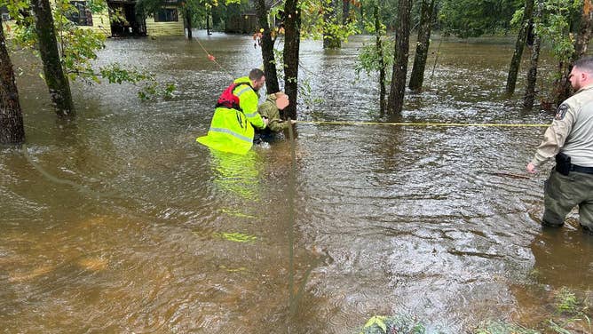 The Lawrence County Sheriff's Office swift-water rescue team had to rescue a female due to rising floodwaters in Moulton, Alabama, on Saturday, Sept. 15, 2024.