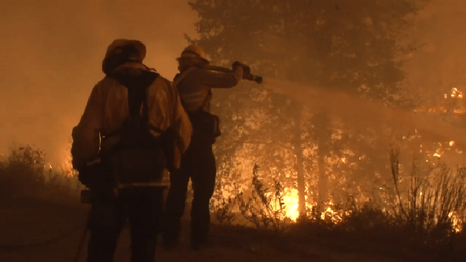 This animated image shows firefighters trying to extinguish the Line Fire in California.