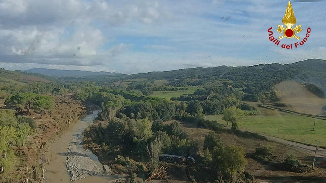 Aerials show flooded area as search goes on for two missing in Tuscany. flooded area as search goes on for two missing in Tuscany�