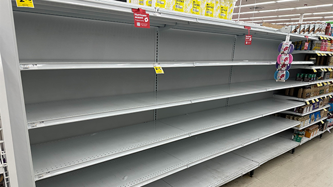 This photo shows empty shelves at a Winn-Dixie in St. Petersburg, Florida, in front of Helene.