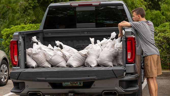 This image shows Florida residents filling sandbags ahead of likely Helene in the coming days. Potential Tropical Cyclone Nine was designated in the Caribbean on Monday, Sept. 23, 2024, and the system is expected to strengthen into a hurricane this week as it moves toward the U.S. Gulf Coast.