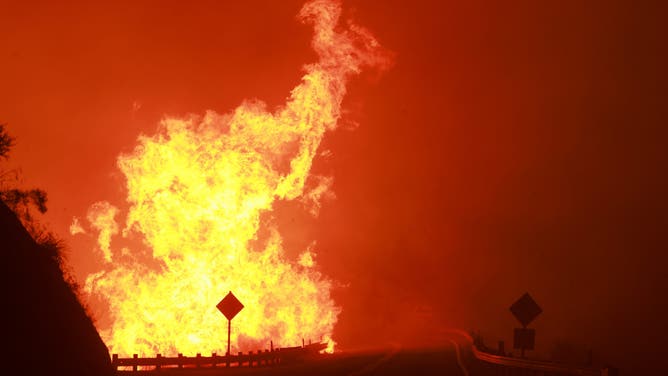 TOPSHOT - Highway 330 is engulfed by the flames of the Line Fire near Running Springs, California, on September 7, 2024. California Governor Gavin Newsom and San Bernardino County authorities declared a state of emergency on September 8. The Line Fire has burned more than 7,000 acres (2,800 hectares). (Photo by DAVID SWANSON / AFP) (Photo by DAVID SWANSON/AFP via Getty Images)