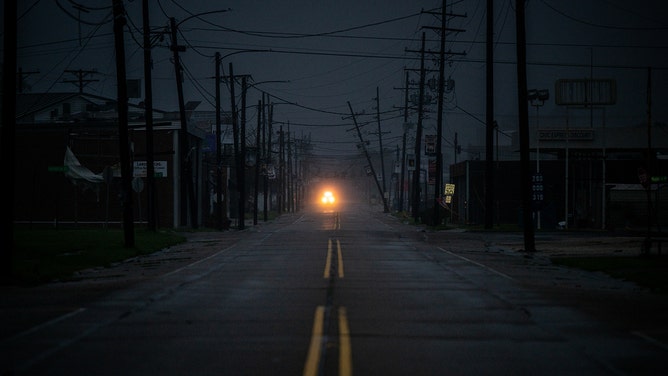 A first responder drives through town after a power outage in Houma, Louisiana on September 11, 2024.