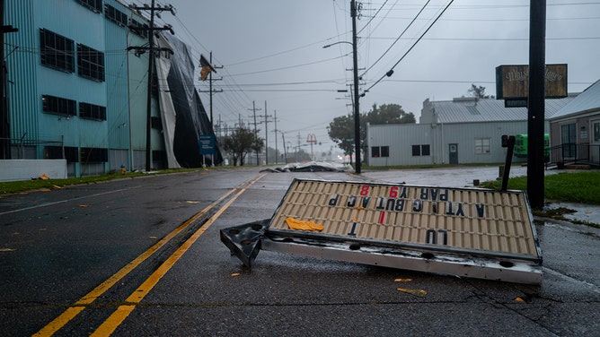 Signs can be seen scattered along the intersection after Hurricane Francine swept through the area in Houma, Louisiana on September 11, 2024.