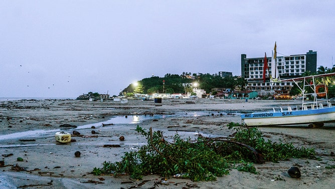 Garbage and debris are pictured on the beach after the arrival of Hurricane John in Puerto Escondido, Oaxaca state, Mexico on September 24, 2024.