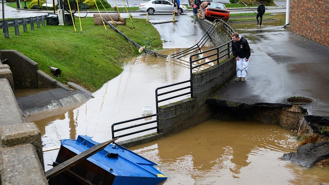 People look at flood damage on September 27, 2024 in Boone, North Carolina.