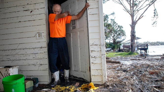 Richard Carmichael rests after beginning cleanup at his home in Steinhatchee, Florida, after Hurricane Helene passed through on Friday, September 27, 2024.