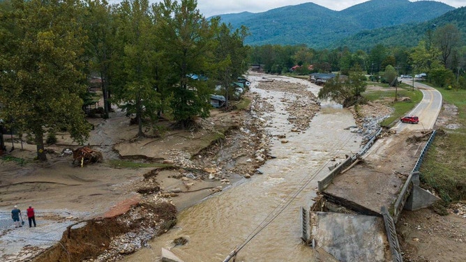 North Cove, N.C. - SEPTEMBER 28: Hurricane Helene caused flooding on the North Fork Catawba River in McDowell County that washed out a bridge on Highway 22 in North Cove, N.C. on Sept. 28, 2024, disconnecting communities and isolating them from already limited resources. (Photo by Julia Wall for The Washington Post via Getty Images)