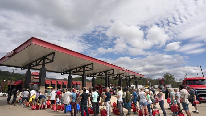 FLETCHER, NORTH CAROLINA - SEPTEMBER 29: People wait in line for gasoline in the aftermath of Hurricane Helene on September 29, 2024 in Fletcher, North Carolina. At least 90 people have been killed across the southeastern U.S. due to the hurricane, according to published reports, which made landfall as a category 4 storm on Thursday. Millions are without power, according to the reports. The White House declared major disasters in North Carolina and Florida, freeing up federal emergency management money for those areas. (Photo by Sean Rayford/Getty Images)