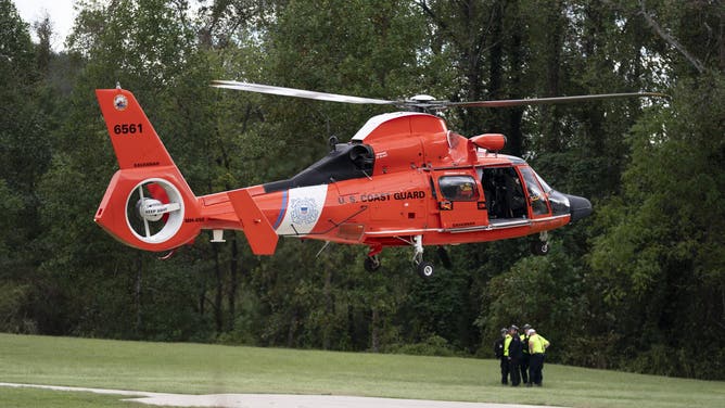 DAVISTOWN, NORTH CAROLINA - SEPTEMBER 29: A U.S. Coast Guard helicopter lifts off in the aftermath of Hurricane Helene on September 29, 2024 near Davistown, North Carolina. At least 90 people have been killed across the southeastern U.S. due to the hurricane, according to published reports, which made landfall as a category 4 storm on Thursday. Millions are without power, according to the reports. The White House declared major disasters in North Carolina and Florida, freeing up federal emergency management money for those areas. (Photo by Sean Rayford/Getty Images)