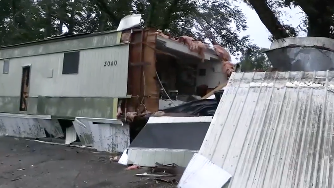 Mobile home ripped open.